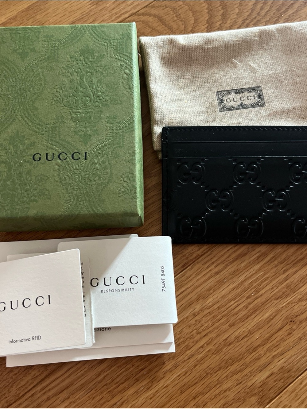 Gucci Black Embossed GG Leather Card Case